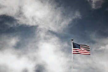 American flag flying against sky