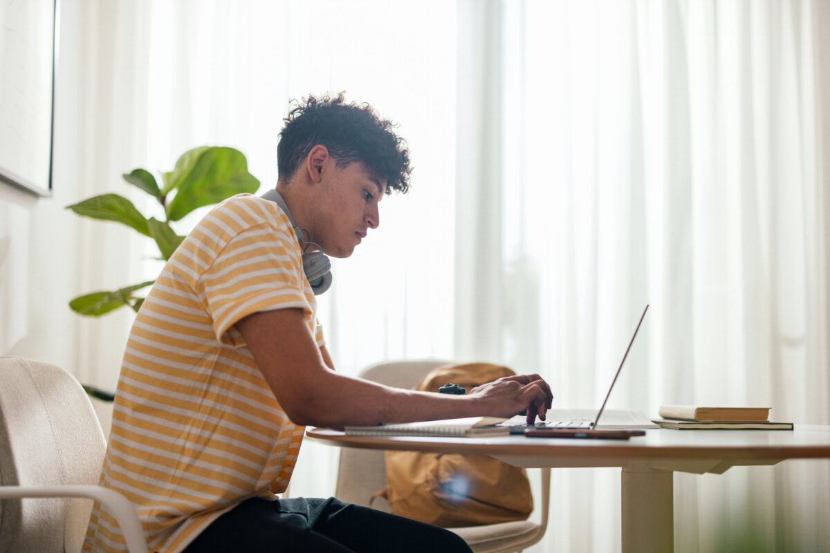Student writing an essay for a competition