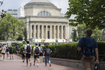 Students on the Columbia University campus in the Morningside Heights neighborhood on the Upper West Side of Manhattan, New York City. Steps of the Low Memorial Library in the background are being restored in the summer.